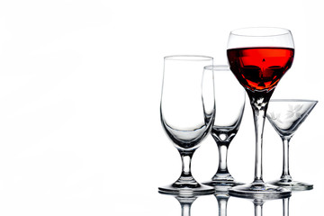 Collage of empty glasses with wine on white background. Free space for text