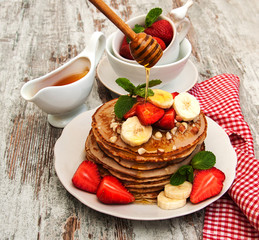 Pancakes with strawberries and bananas