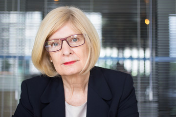 Closeup Portrait of Serious Senior Business Woman