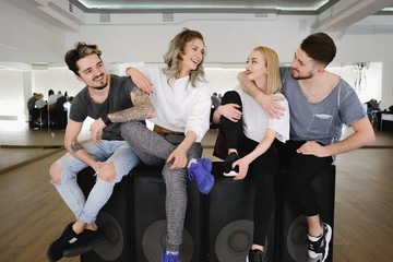 Cheerful group of friends having fun together indoor