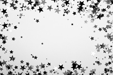 Obraz premium Abstract background with scattered Confetti stars.