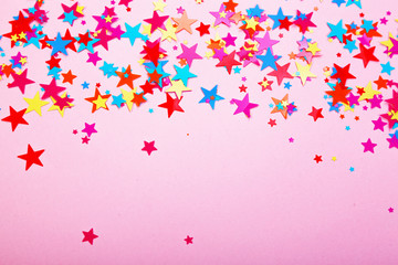 Abstract background with scattered Confetti stars.
