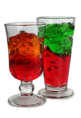 Fruit cocktail in a glass goblet on a white background