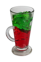 Fruit cocktail in a glass goblet on a white background