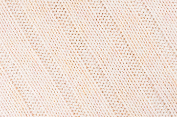 Beige soft knitted fabric texture with strips wale.