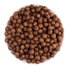 Chocolate balls corn flakes in white bowl isolated, top view. Cereals.
