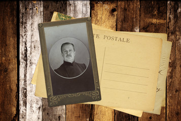 Vintage post cards and retro photo on old wooden planks