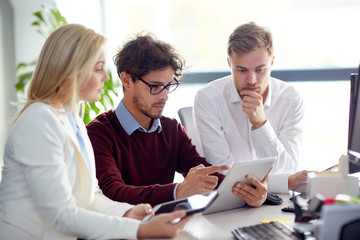 business team with tablet pc at office