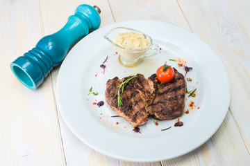 appetizing roasted meat on a white plate