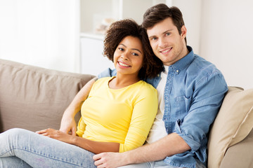 happy smiling international couple at home