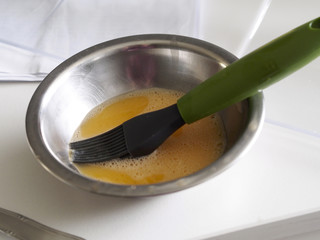 Cooking brush with raw egg