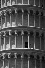Fototapeta na wymiar Columns Leaning Tower closeup (black and white background texture - concept)