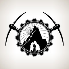 Fototapeta premium Miner in the Helmet is Holding Pickaxe in the Bowels of the Mountain on a Background of the Sunburst in a Gear with Two Crossed Pickaxes , Vintage Emblem of the Mining Industry, Vector Illustration