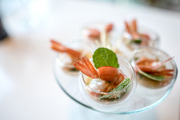 Selective focus on Spicy Prawn or Shrimp steamed with lemon salads and mint on top, Thai Food