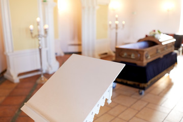 stand or tribune and coffin in church
