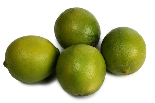 Green lemon fruits on a white background