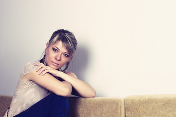 Lonely sad woman deep in the thoughts