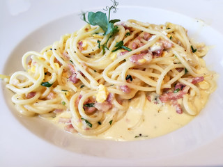 tasty pasta with roast ham on the table