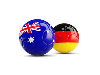 Two footballs with flags of Australia and Germany isolated on white