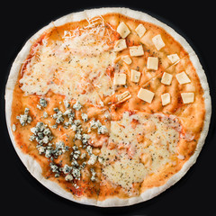 Pizza with different kinds of cheese on a dark background