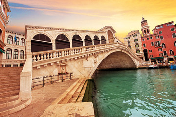 Fototapeta na wymiar Bright charming landscape with Rialto Bridge at dawn in Venice, Italy, Europe