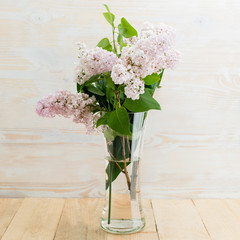 lilac flowers in the glass vase