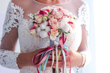 The bride is holding a bouquet