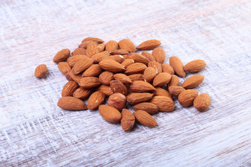 nuts almonds on wooden background. Selective focus.
