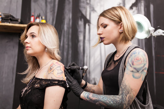 Tattoo artist in a studio