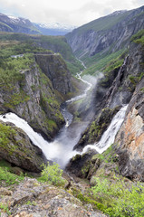 Naklejka na ściany i meble Voringsfossen, the 83rd highest waterfall in Norway on the basis of total fall. It is perhaps the most famous waterfall in the country and a major tourist attraction.