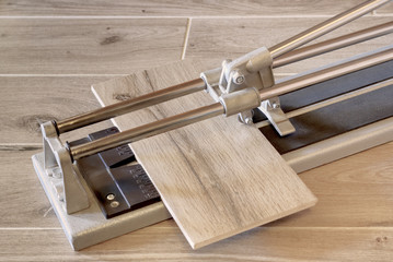 Hand tile cutter with tile.
