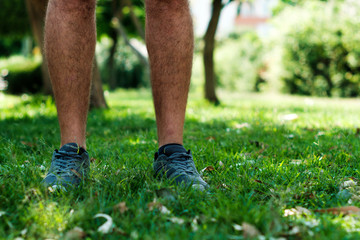Legs of a man with sport shoes