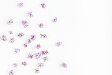 Flowers composition. Lilac flowers on white background. Flat lay, top view