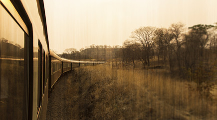 travelling old train perspective landscape antique looking background in sepia