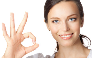 Business woman with okay gesture, on white
