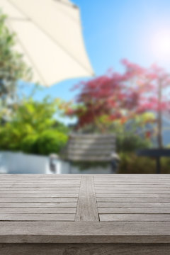 Fototapeta Rustic wooden table in summer