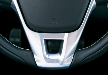 Close up view of steering wheel, Black leather car interior design, details