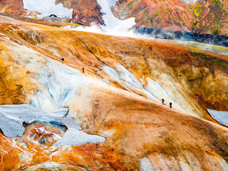 Group of hikers going up the path at Landmannalaugar, Laugavegur trek, Iceland.