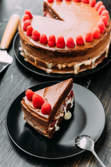 Chocolate truffle cake with cherry in cognac and raspberry