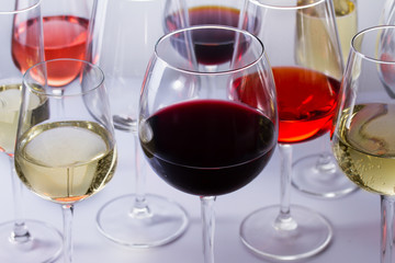 Set of party glasses with red, white and rose wine close up
