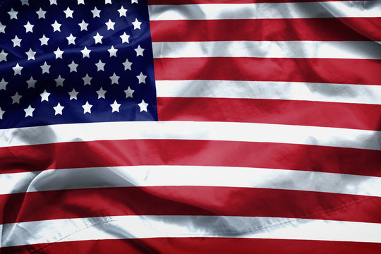 American flag background. Closeup of ruffled American flag