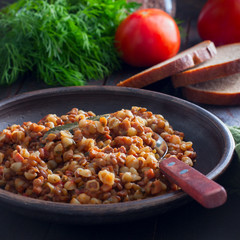 Italian small pasta with lentils in a clay bowl, square