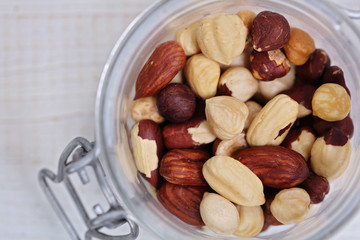 Mixed nuts on in a bowl : almond, cashew, peanuts, hazelnuts. Nutrition, healthy eating concept