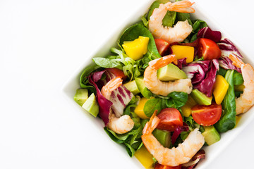 Shrimps salad with mango and avocado isolated on white background
