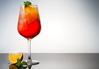 Glass of spritz coctail on table with copy space