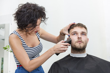 The young man at the hairdresser salon hairstyle make model