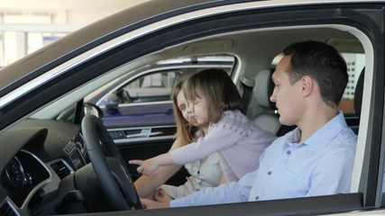 customers in car dealer, new machine for family, spouses speak in new vehicle, family in car center, joy of buying automobile, portrait of happy people, fusband and wife watching auto inside,