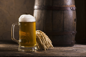 Glasses of light and dark beer on a pub background.