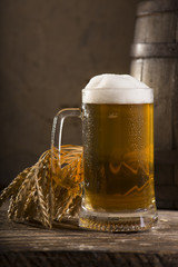 Glasses of light and dark beer on a pub background.