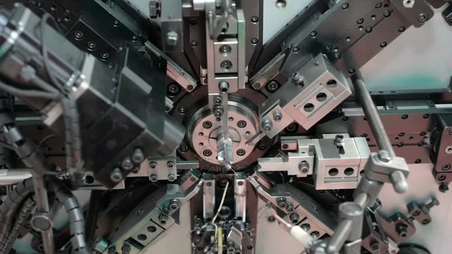 Automatic CNC bending machine. Manufacturing of a torsion spring